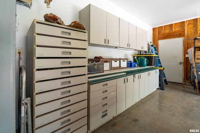 243 Pump Station Rd, Makanda, IL 62958 - kitchen with concrete flooring and white cabinetry