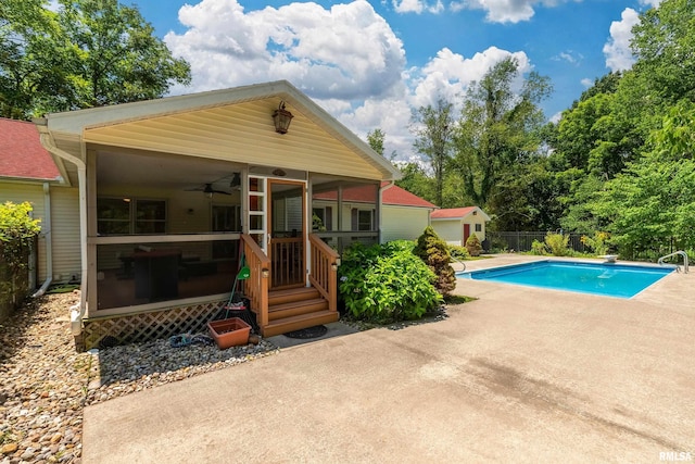 243 Pump Station Rd, Makanda, IL 62958 - swimming pool featuring a sunroom, a diving board, a patio, and a ceiling fan