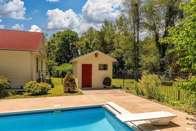 243 Pump Station Rd, Makanda, IL 62958 - view of swimming pool with a diving board, an outbuilding, and a patio