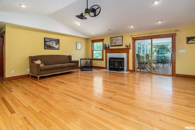 243 Pump Station Rd, Makanda, IL 62958 - living room featuring light wood finished floors, lofted ceiling, and a tile fireplace