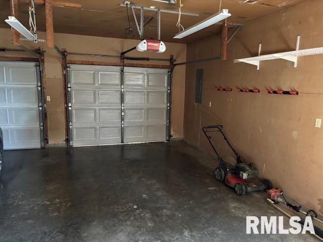 15944 Moellers Rd, Marion, IL 62959 - garage featuring a garage door opener and electric panel