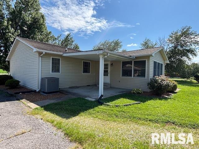 15944 Moellers Rd, Marion, IL 62959 - rear view of property featuring a lawn and a patio