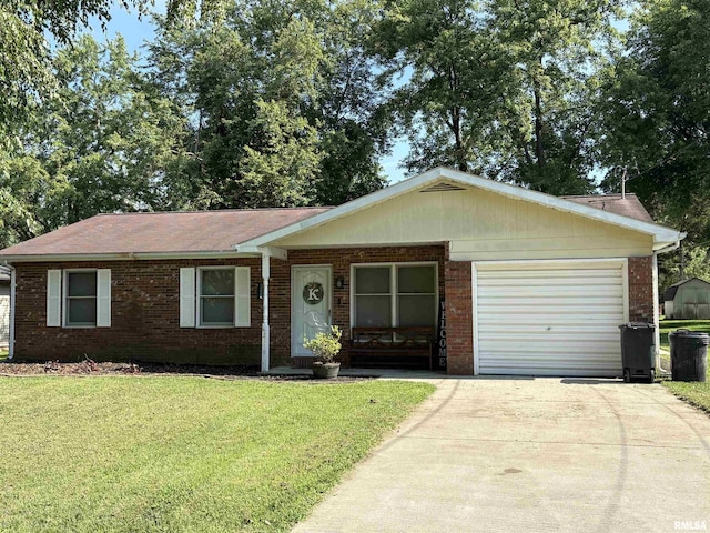 2119 Rains St, Murphysboro, IL 62966 - single story home featuring brick siding, an attached garage, concrete driveway, and a front yard