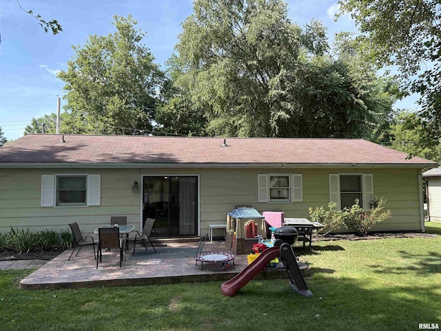2119 Rains St, Murphysboro, IL 62966 - back of house featuring a patio, a yard, and a shingled roof