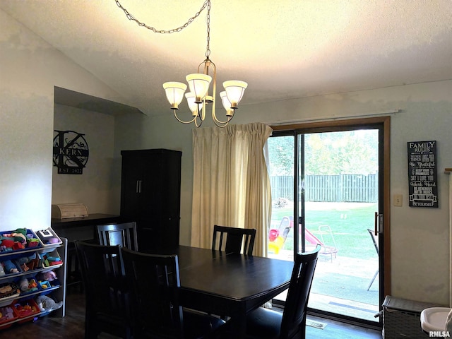 2119 Rains St, Murphysboro, IL 62966 - dining room with a chandelier, a textured ceiling, lofted ceiling, and dark wood finished floors