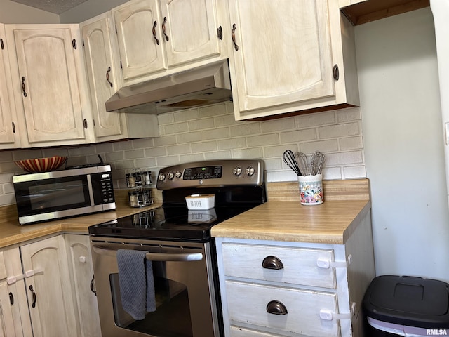 2119 Rains St, Murphysboro, IL 62966 - kitchen featuring stainless steel appliances, under cabinet range hood, light countertops, and tasteful backsplash
