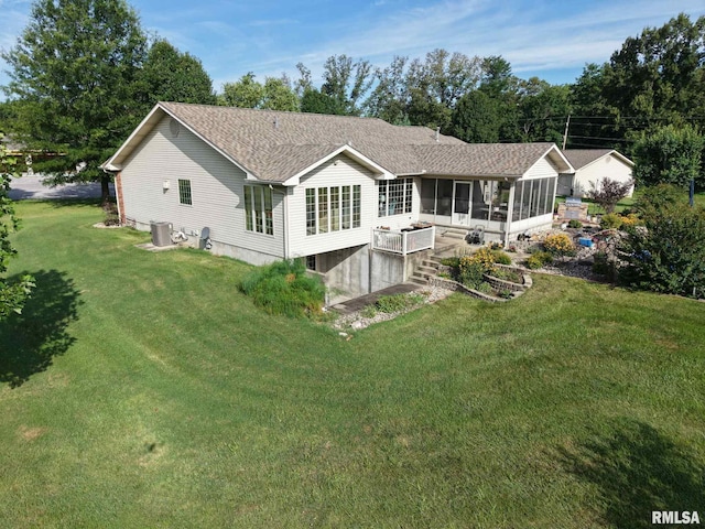 1016 Michael Ln, West Frankfort, IL 62812 - rear view of property with a sunroom, a yard, and roof with shingles
