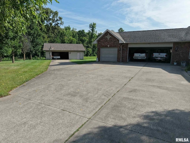 1016 Michael Ln, West Frankfort, IL 62812 - view of home's exterior with a yard, brick siding, and driveway