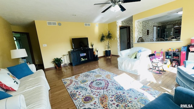 1016 Michael Ln, West Frankfort, IL 62812 - living area featuring a ceiling fan, wood finished floors, and radiator