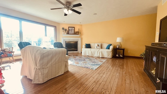 1016 Michael Ln, West Frankfort, IL 62812 - living room with hardwood / wood-style floors, a tiled fireplace, and ceiling fan