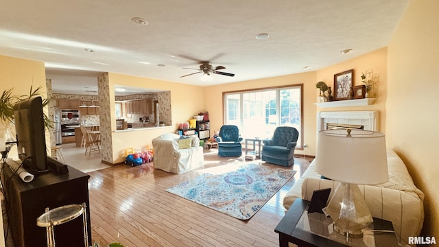 1016 Michael Ln, West Frankfort, IL 62812 - living room featuring a ceiling fan, hardwood / wood-style floors, recessed lighting, and a fireplace