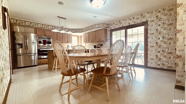 1016 Michael Ln, West Frankfort, IL 62812 - dining room featuring wallpapered walls and light floors