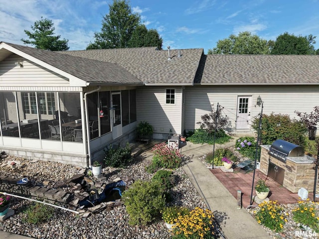 1016 Michael Ln, West Frankfort, IL 62812 - rear view of property featuring area for grilling, a sunroom, roof with shingles, and a patio area