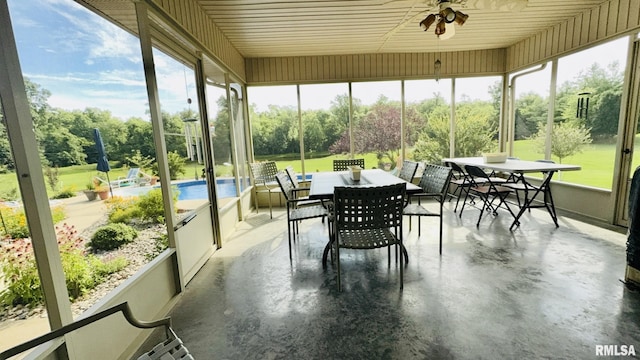 1016 Michael Ln, West Frankfort, IL 62812 - sunroom featuring outdoor dining space, ceiling fan, and view of scattered trees