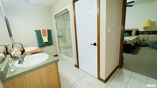 1016 Michael Ln, West Frankfort, IL 62812 - bathroom featuring ensuite bathroom, a stall shower, double vanity, and tile patterned floors