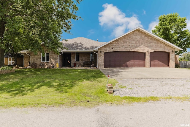 11823 Taylor Dr, Marion, IL 62959 - single story home featuring concrete driveway, an attached garage, a front yard, and brick siding