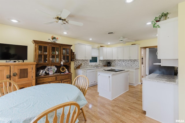 11823 Taylor Dr, Marion, IL 62959 - kitchen with ceiling fan, white dishwasher, black electric cooktop, white cabinets, and recessed lighting