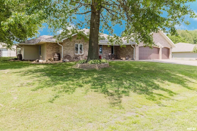 11823 Taylor Dr, Marion, IL 62959 - single story home featuring an attached garage, a front lawn, brick siding, and driveway