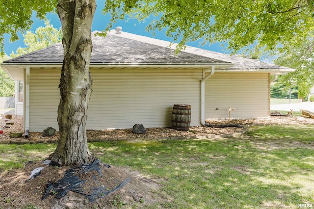 11823 Taylor Dr, Marion, IL 62959 - view of home's exterior with roof with shingles and a yard