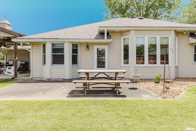 11823 Taylor Dr, Marion, IL 62959 - back of house with a patio area, a yard, a shingled roof, and a ceiling fan