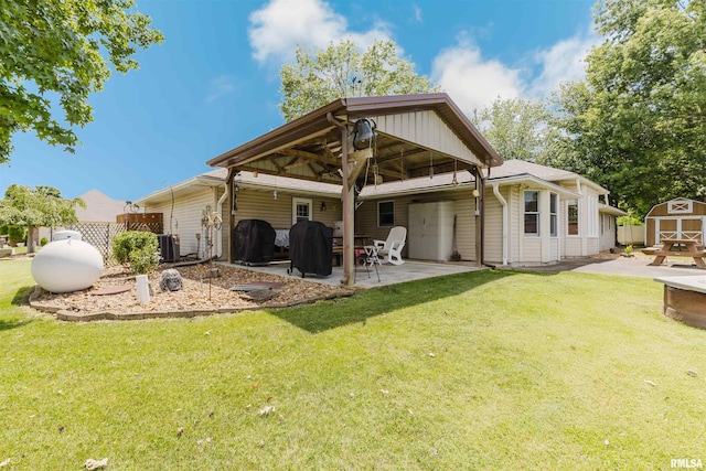 11823 Taylor Dr, Marion, IL 62959 - rear view of house with a shed and a patio area
