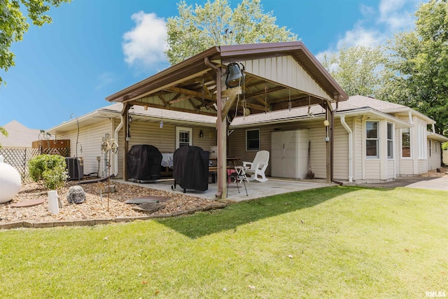 11823 Taylor Dr, Marion, IL 62959 - back of property featuring a lawn, a patio, and a gazebo