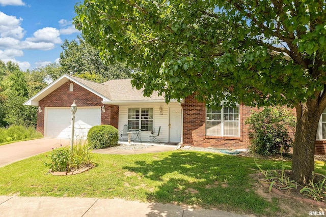 508 Lexington Ct, Carbondale, IL 62901 - view of front of property featuring brick siding, concrete driveway, an attached garage, and a front lawn