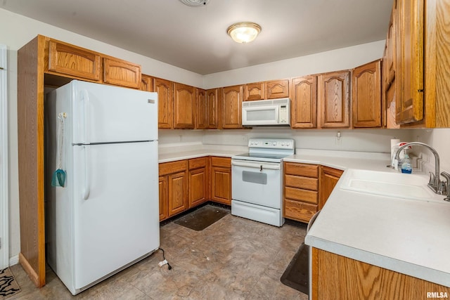 508 Lexington Ct, Carbondale, IL 62901 - kitchen with white appliances, brown cabinetry, and light countertops
