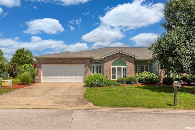 1002 Villa Ct, Carbondale, IL 62901 - ranch-style house with a garage, brick siding, driveway, and a front yard