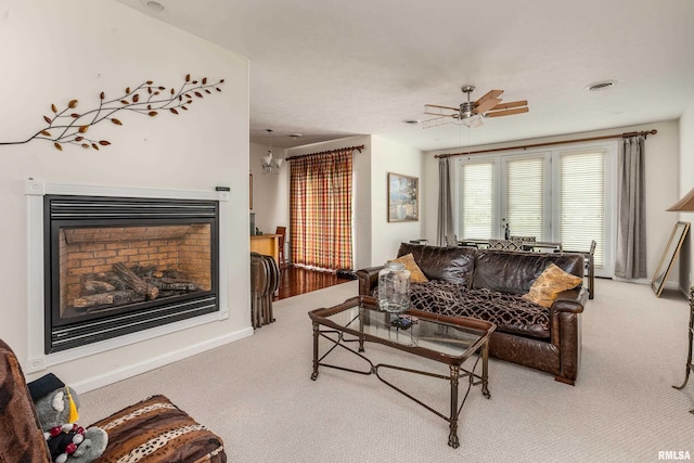 1002 Villa Ct, Carbondale, IL 62901 - living room with carpet floors, a glass covered fireplace, and ceiling fan
