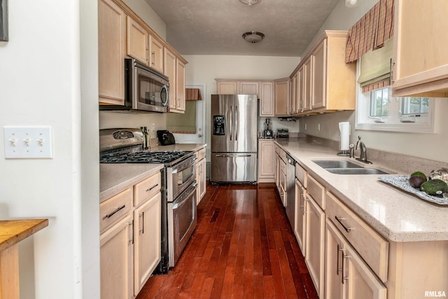 1002 Villa Ct, Carbondale, IL 62901 - kitchen featuring appliances with stainless steel finishes, dark wood finished floors, light brown cabinets, and light stone countertops