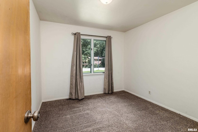 1811 W Freeman St, Carbondale, IL 62901 - empty room featuring carpet floors and baseboards