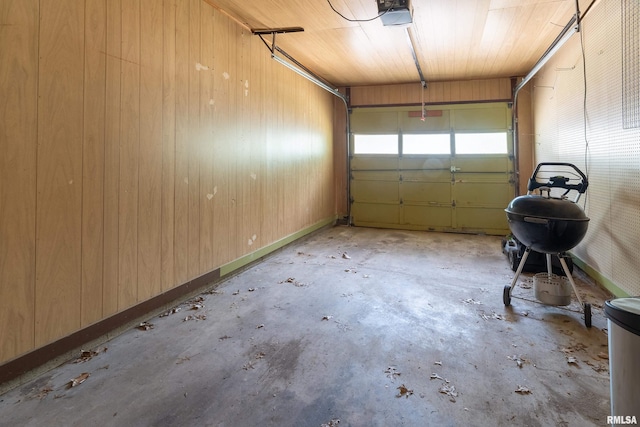 1811 W Freeman St, Carbondale, IL 62901 - garage featuring a garage door opener and wood walls