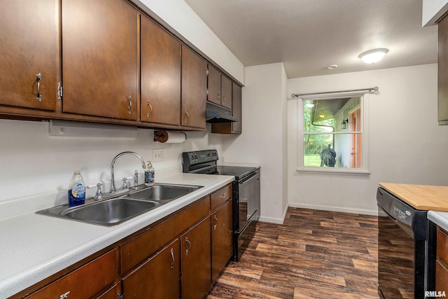 1811 W Freeman St, Carbondale, IL 62901 - kitchen featuring black appliances, under cabinet range hood, dark wood finished floors, and light countertops