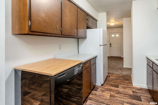 1811 W Freeman St, Carbondale, IL 62901 - kitchen featuring dishwasher, dark wood-type flooring, light countertops, and freestanding refrigerator