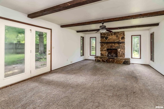 1811 W Freeman St, Carbondale, IL 62901 - unfurnished living room with healthy amount of natural light, ceiling fan, carpet, beam ceiling, and a fireplace