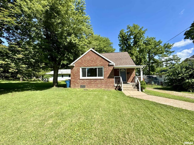 403 Freeman St, Anna, IL 62906 - view of front of home featuring brick siding, a front lawn, and a shingled roof
