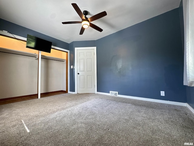 403 Freeman St, Anna, IL 62906 - unfurnished bedroom with carpet flooring, a closet, and a ceiling fan