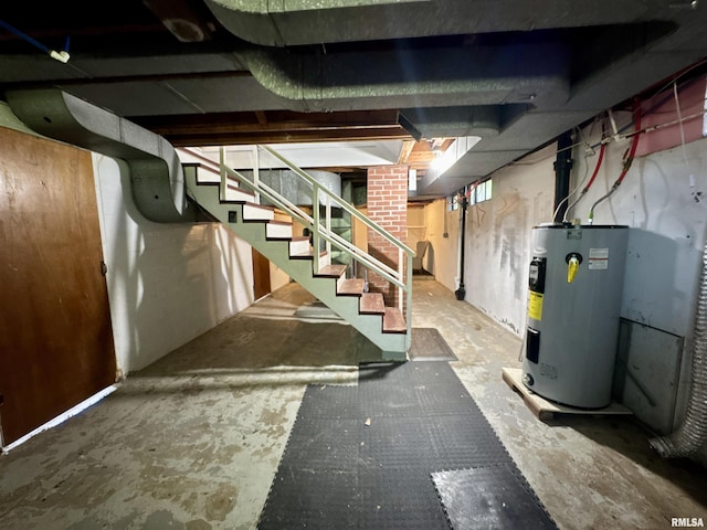 403 Freeman St, Anna, IL 62906 - unfinished basement with electric water heater and stairs