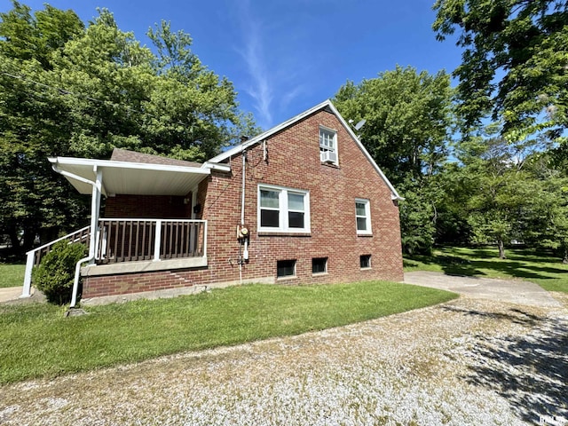403 Freeman St, Anna, IL 62906 - view of home's exterior featuring brick siding and a lawn