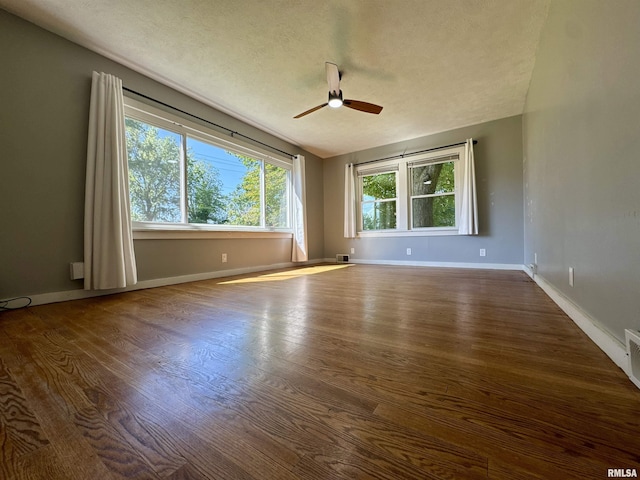 403 Freeman St, Anna, IL 62906 - spare room featuring ceiling fan, dark wood-style flooring, a textured ceiling, and lofted ceiling