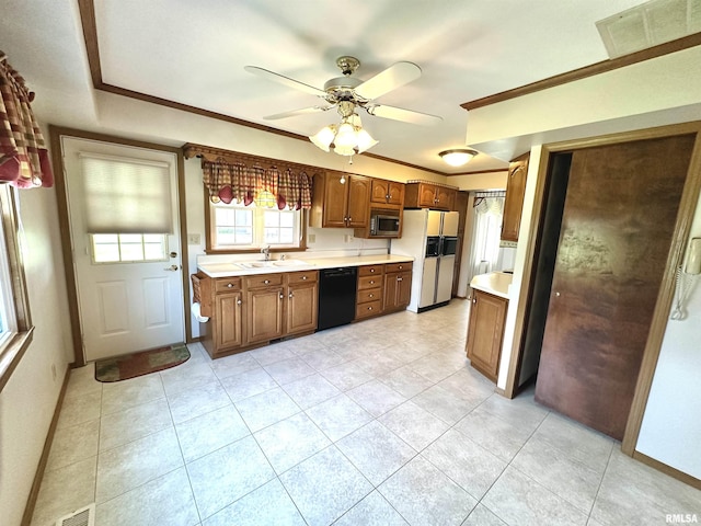 1915 W 4th St, Centralia, IL 62801 - kitchen featuring black dishwasher, white refrigerator with ice dispenser, stainless steel microwave, light countertops, and light tile patterned floors