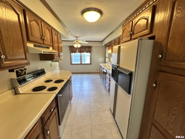 1915 W 4th St, Centralia, IL 62801 - kitchen featuring under cabinet range hood, white appliances, ceiling fan, light countertops, and light tile patterned floors