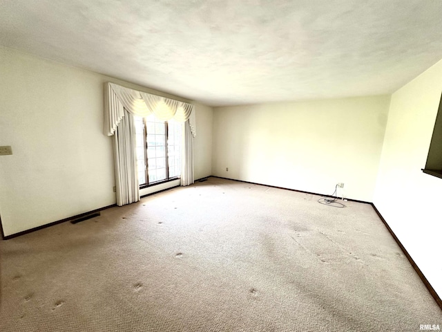 1915 W 4th St, Centralia, IL 62801 - empty room with baseboard heating and carpet floors