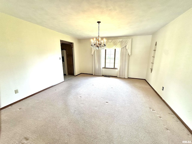 1915 W 4th St, Centralia, IL 62801 - unfurnished room with a chandelier and light colored carpet