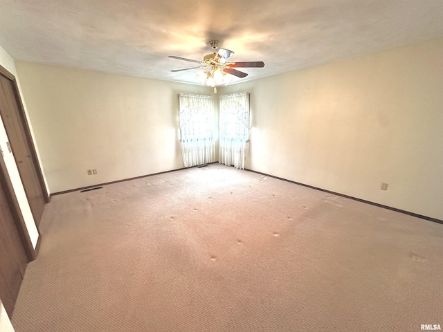 1915 W 4th St, Centralia, IL 62801 - empty room featuring ceiling fan and light colored carpet