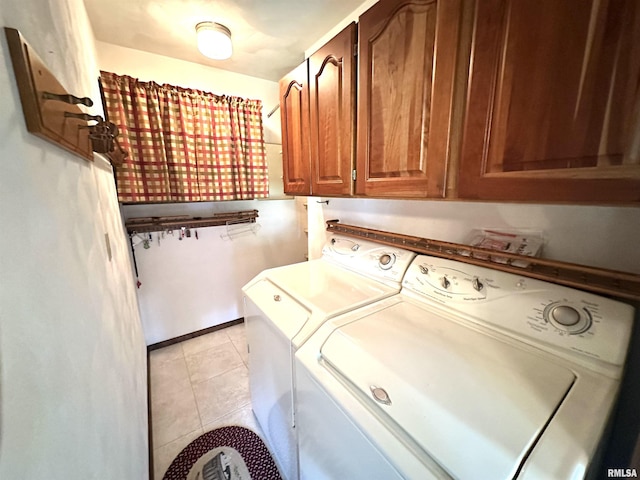 1915 W 4th St, Centralia, IL 62801 - washroom with separate washer and dryer, cabinet space, and light tile patterned floors