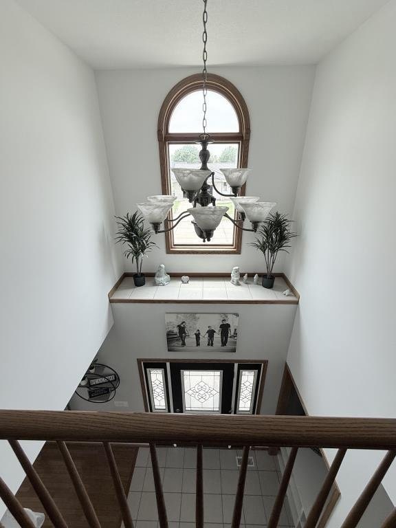 418 Michelle Ln, Walcott, IA 52773 - entryway featuring a chandelier