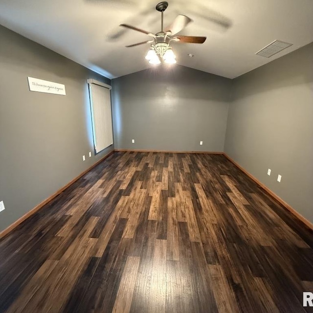 418 Michelle Ln, Walcott, IA 52773 - unfurnished room with vaulted ceiling, a ceiling fan, and dark wood finished floors
