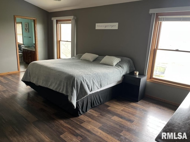 418 Michelle Ln, Walcott, IA 52773 - bedroom with wood finished floors and ensuite bathroom